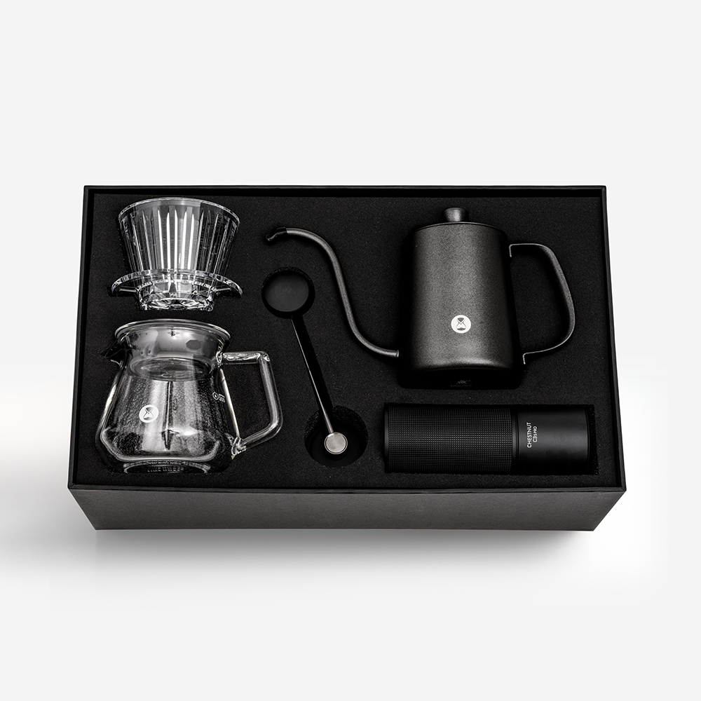 TIMEMORE C3S Pro all-in-one pour-over coffee brewing kit with grinder, transparent B75 dripper, server, black gooseneck kettle, cleaning brush, filter papers, and thermometer in black gift box