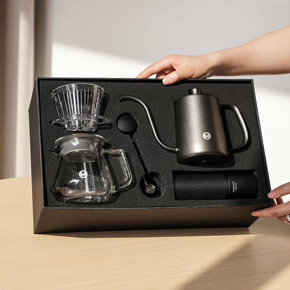 TIMEMORE C3S Pro pour-over coffee kit with grinder, dripper, kettle, glass server, and accessories in black and transparent design