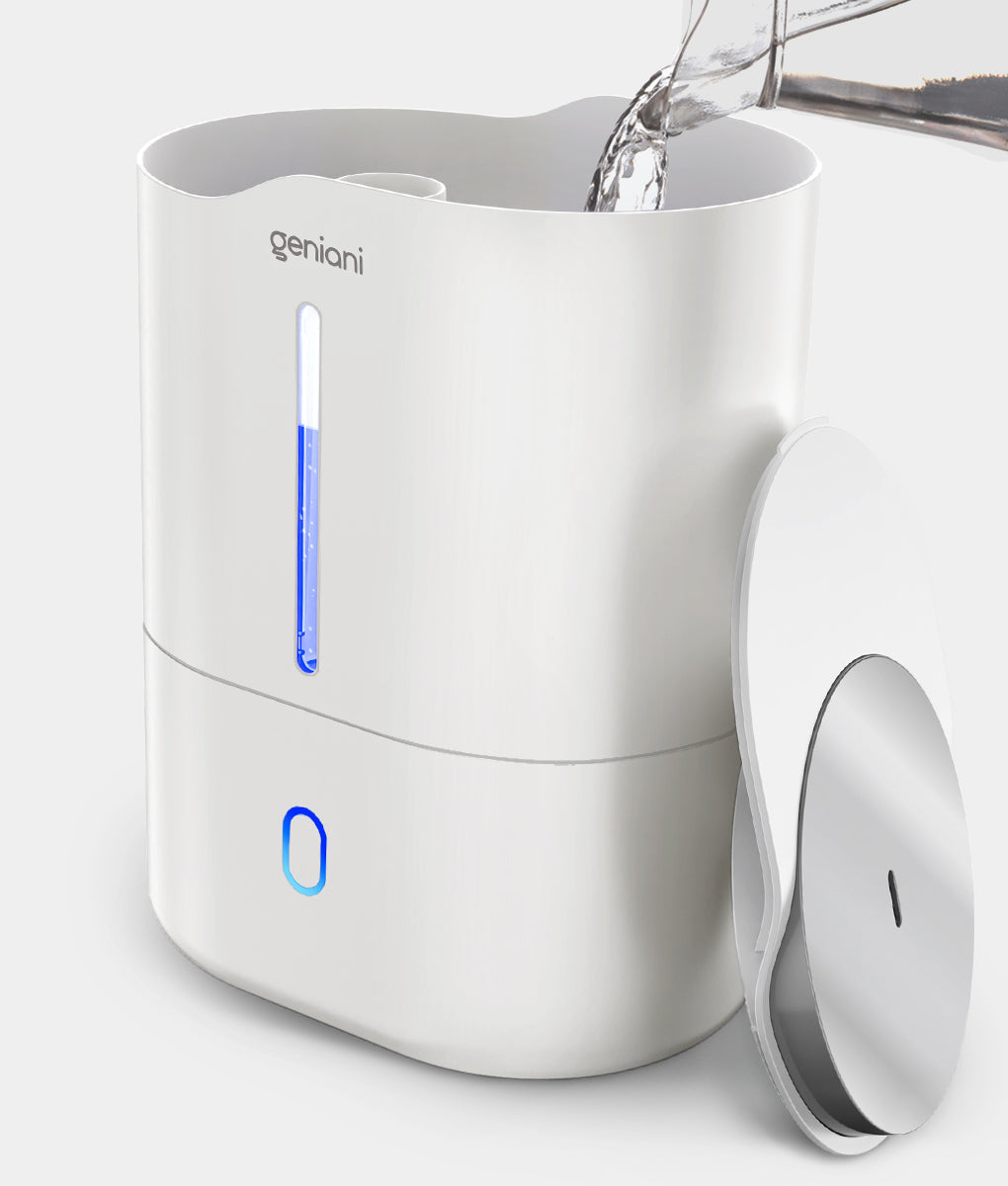 White bedroom humidifier with blue LED light and removable lid showing water refill in progress