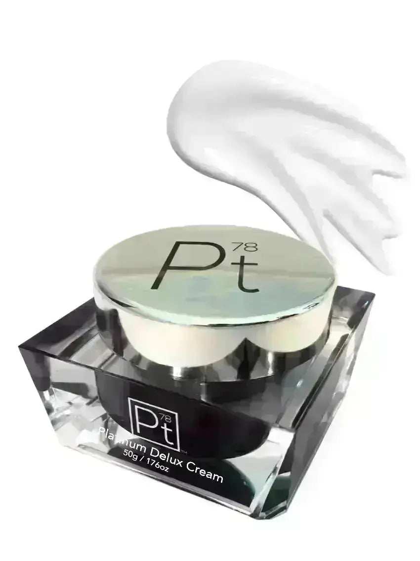 Platinum Deluxe Cream jar with silver lid and creamy white moisturizer swirl on white background.