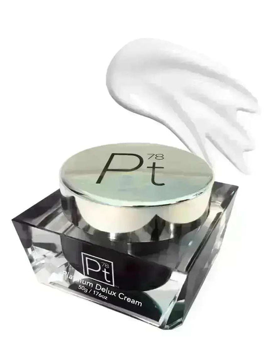 Platinum Deluxe Cream anti-aging moisturizer in a clear square jar with silver lid and creamy white texture.
