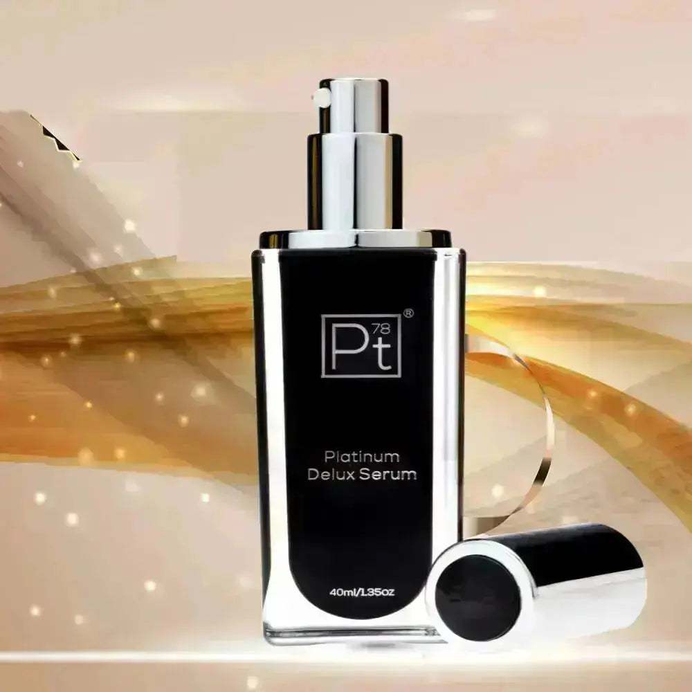 Platinum Delux Serum bottle with silver pump and cap on a golden background, anti-aging skincare product