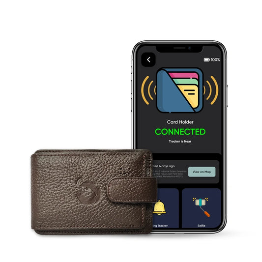 Brown premium leather Dolphin Card Holder with built-in Bluetooth GPS tracker shown alongside connected tracking app on smartphone screen